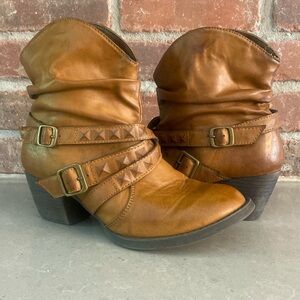 Mia Sz 7 leather slip on ankle boot with buckles and brown in color